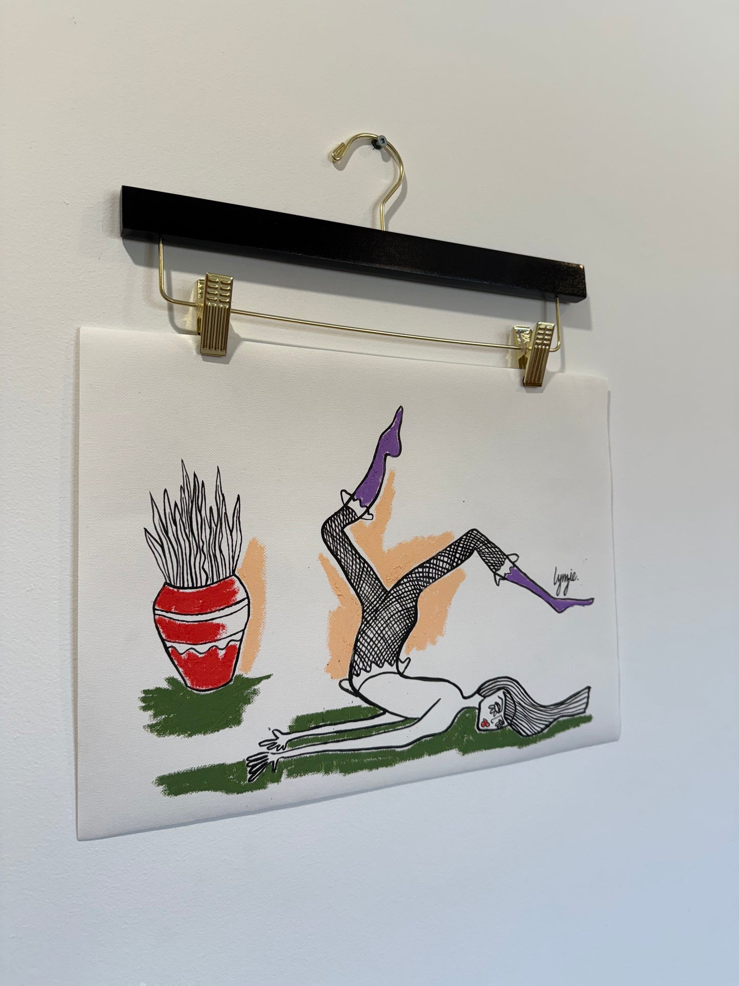 Angled view of Little Lady #2 by Lynzie Bremner – reclining figure in purple boots with red vase.