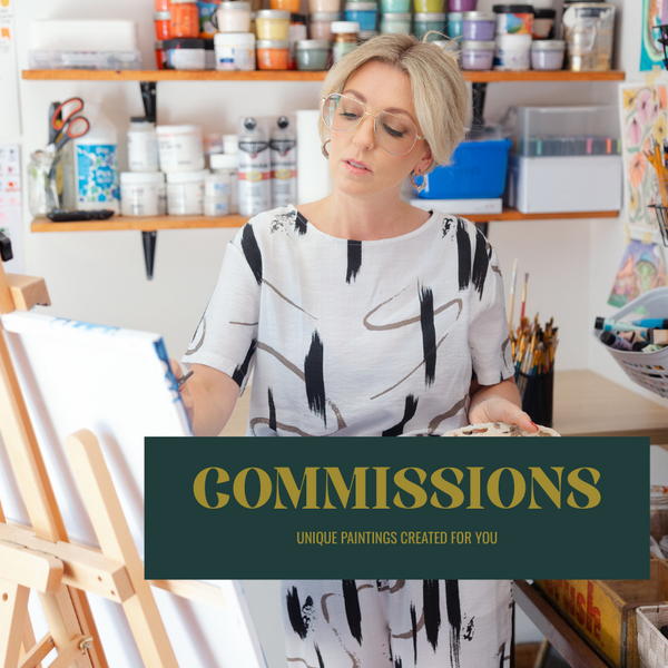 Artist working in her studio, painting on a canvas while surrounded by paint supplies and brushes, offering custom commissions for unique artwork.