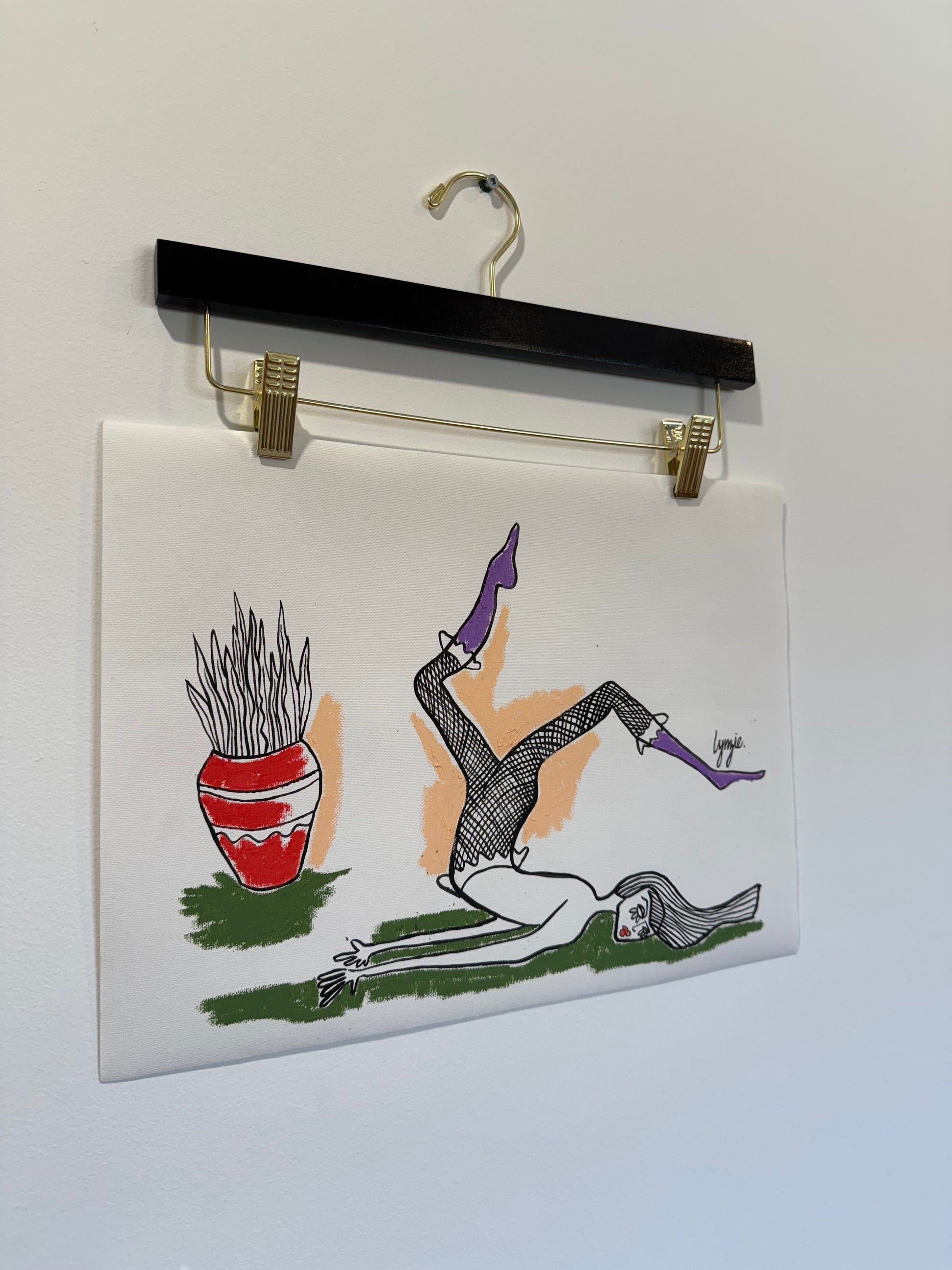 Angled view of Little Lady #2 by Lynzie Bremner – reclining figure in purple boots with red vase.